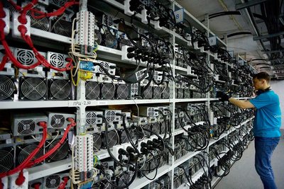 A large-scale mining farm filled with rows of GPU mining rigs humming with energy